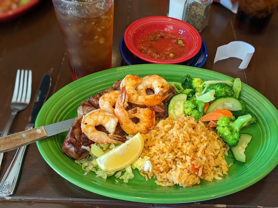 Colorful Latin American plates on a restaurant table.